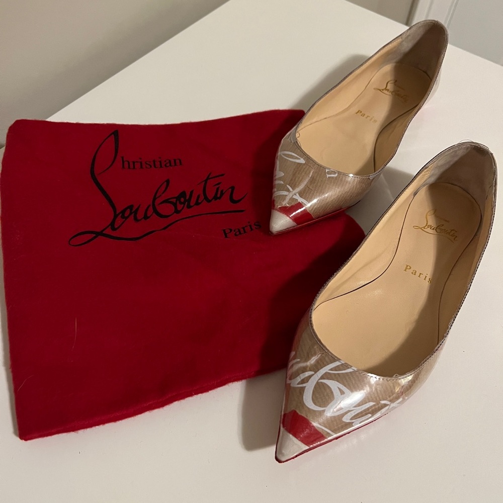 Louboutin flats, pvc over brand paper